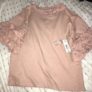Pink a. n. a shirt with ruffled sleeves and pearls